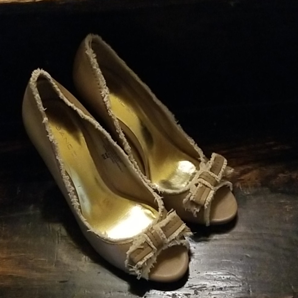 Beige pumps - approximately 4 inches high